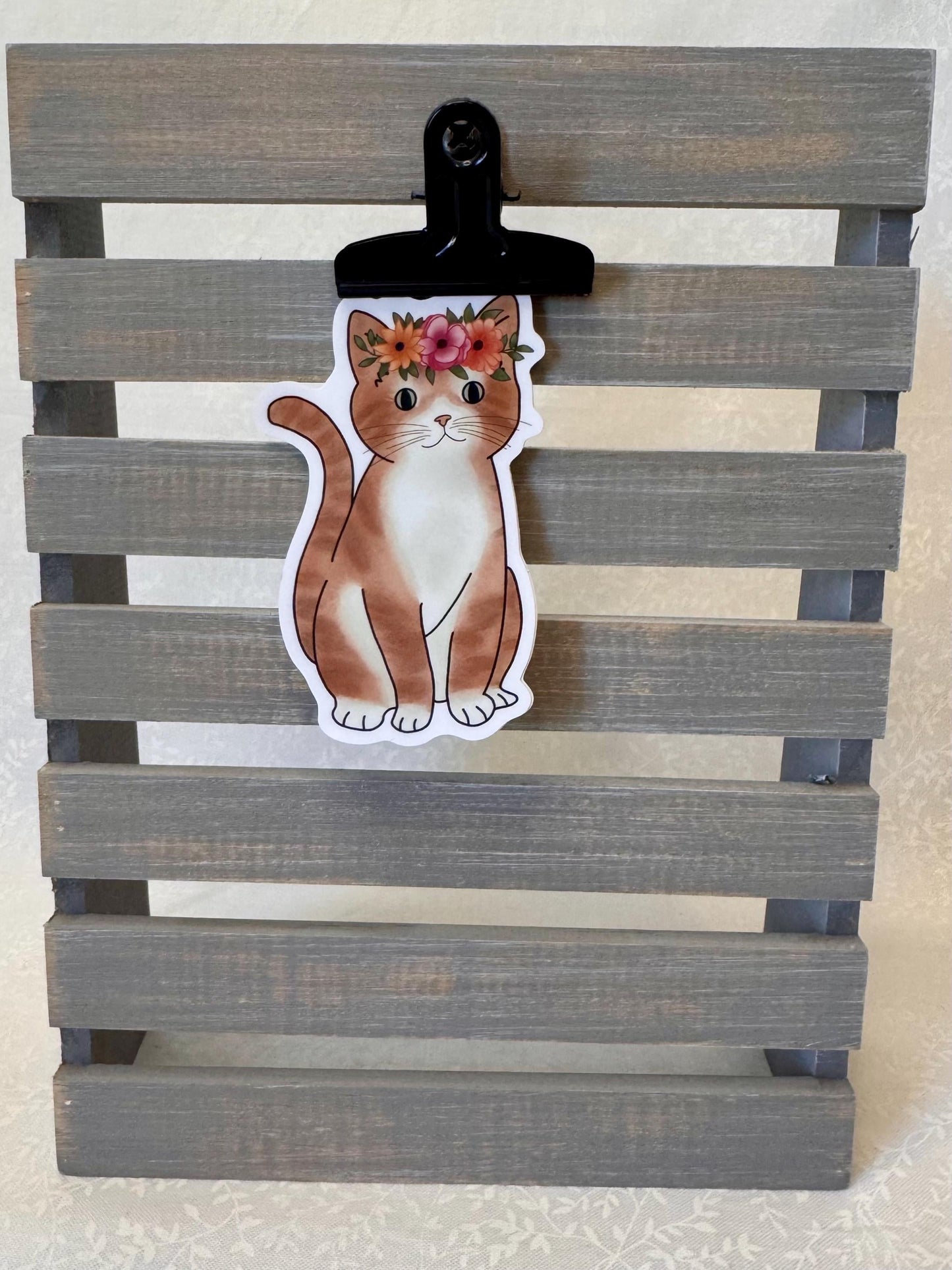 Orange tabby cat with flower crown | Sticker