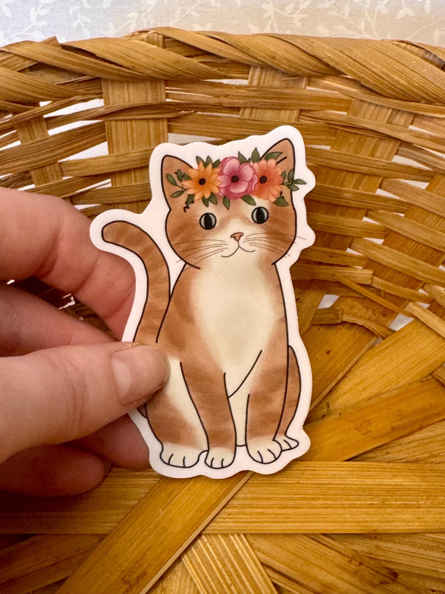 Orange tabby cat with flower crown | Sticker