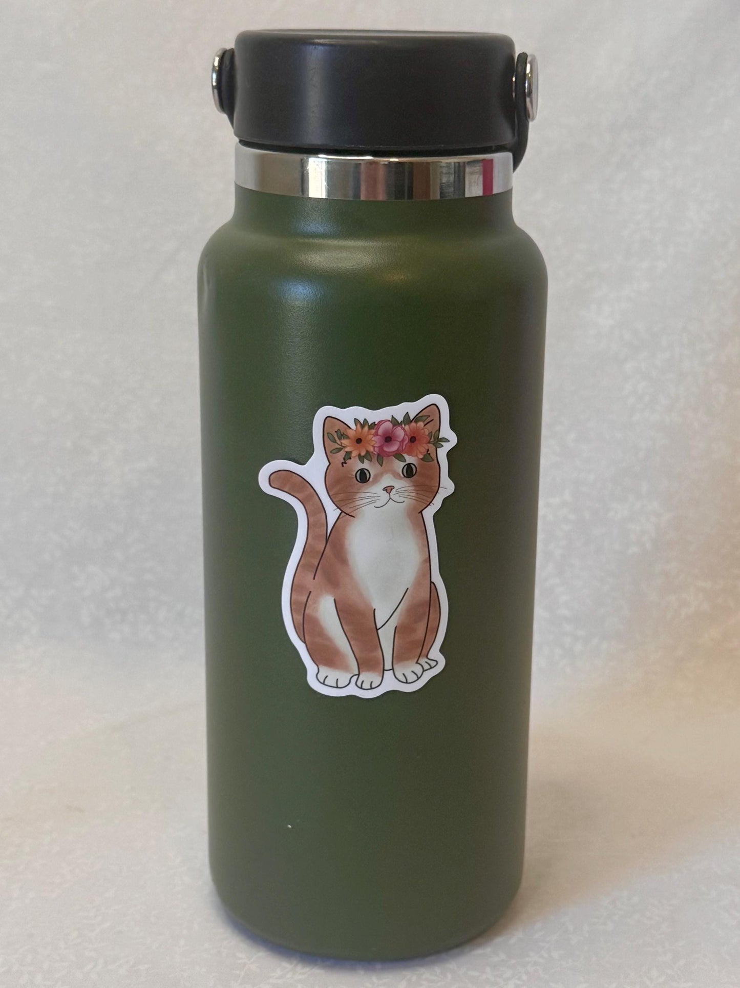 Orange tabby cat with flower crown | Sticker